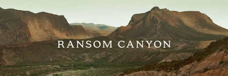 Text overlay: "RANSOM CANYON" with a mountainous background.